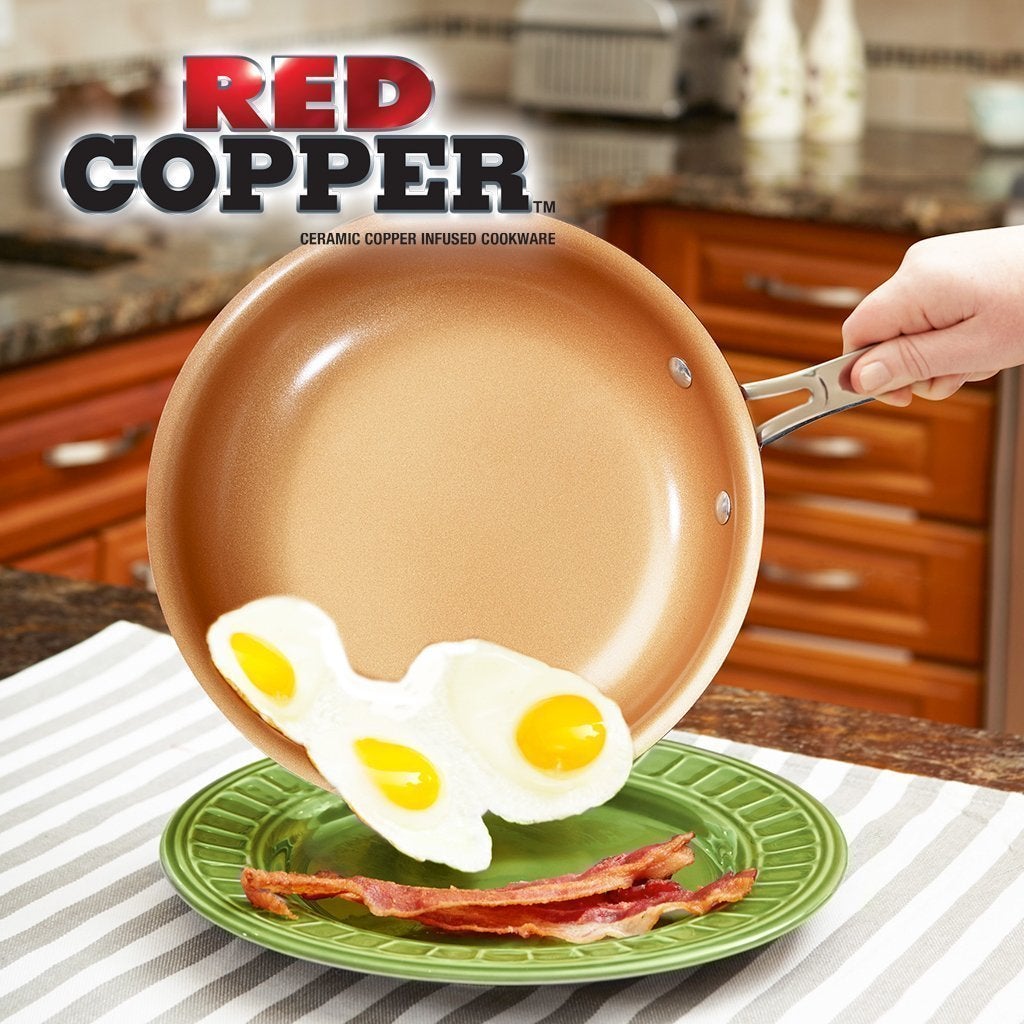Red Copper frying pan shown serving eggs and bacon