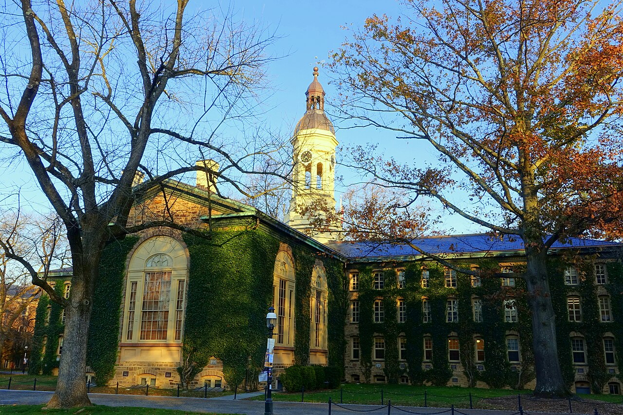Nassau Hall at Princeton University, with its stone facade, cupola and autumn trees